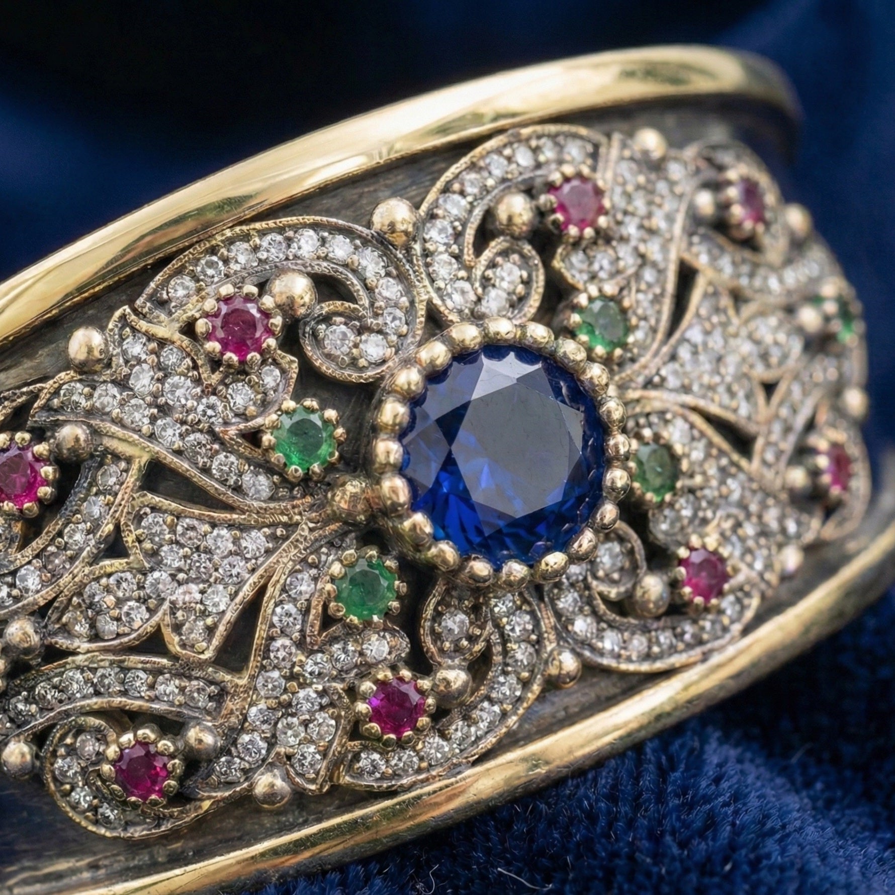 Decorative bracelet with gemstones on a blue background