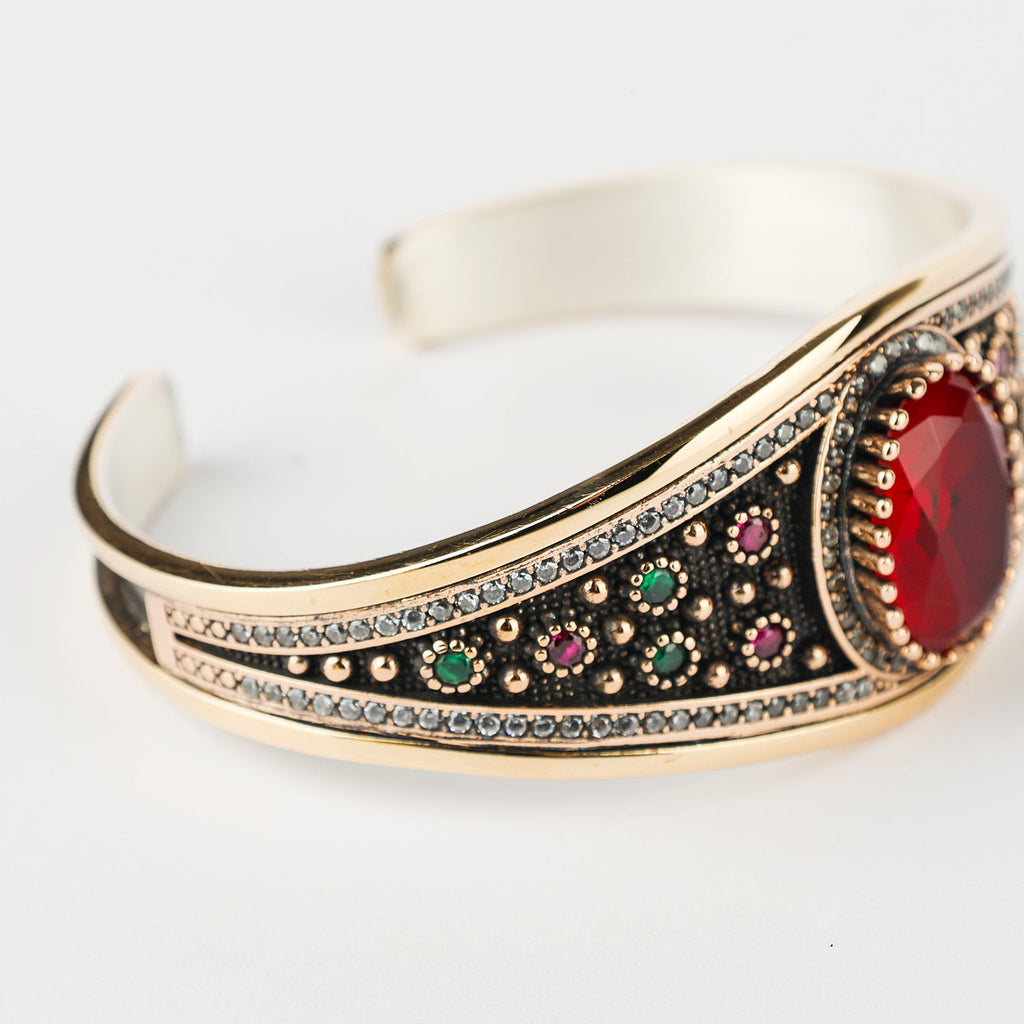Decorative bracelet with gemstones on a white background